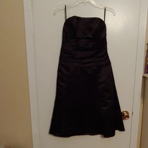 Black satin strapless dress.